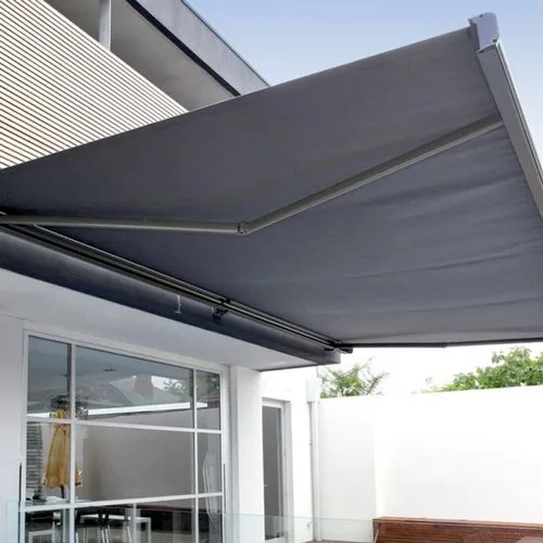 Folding arm awning extended over alfresco entertaining area