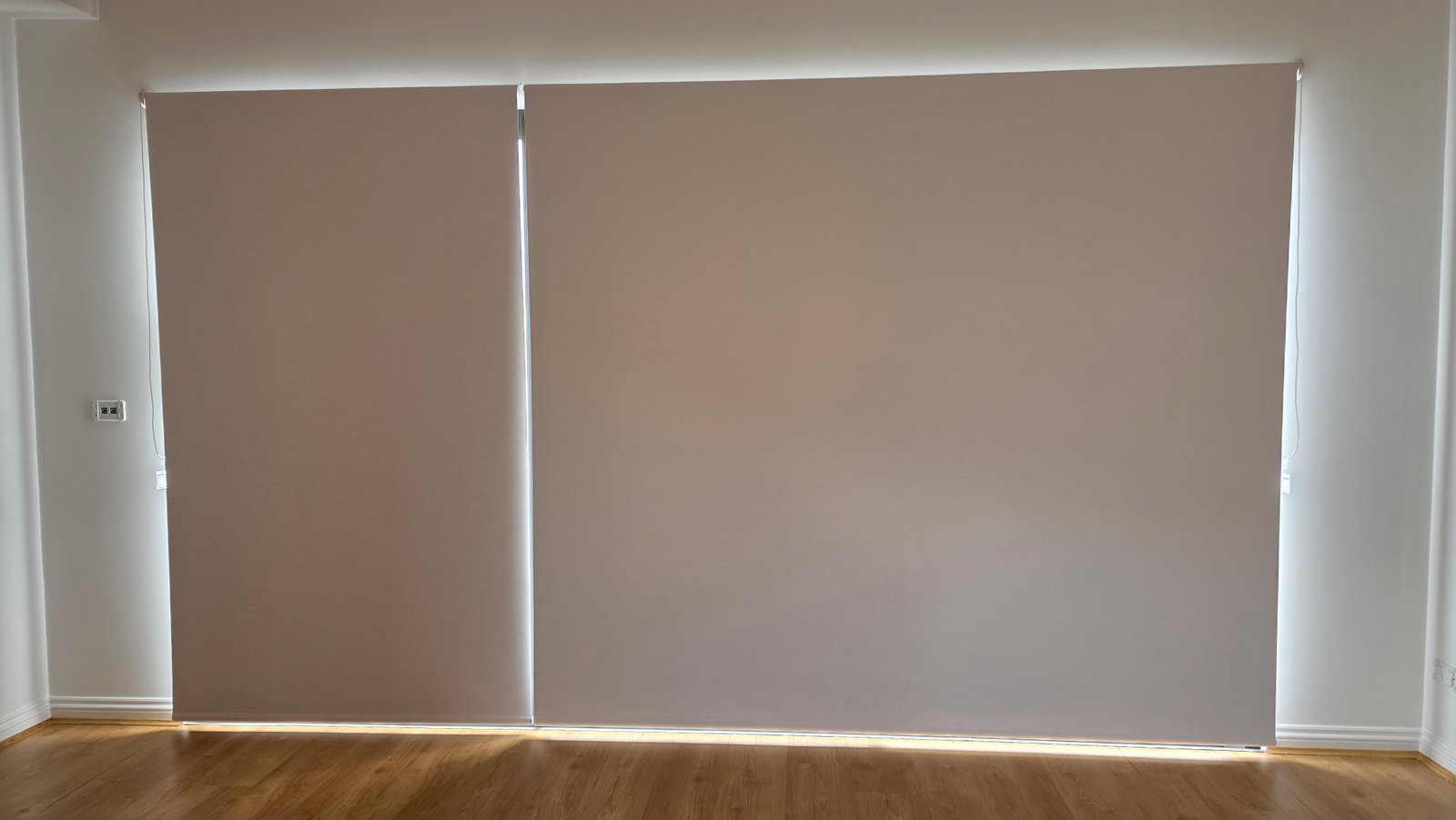Full blockout roller blinds covering entire sliding door wall